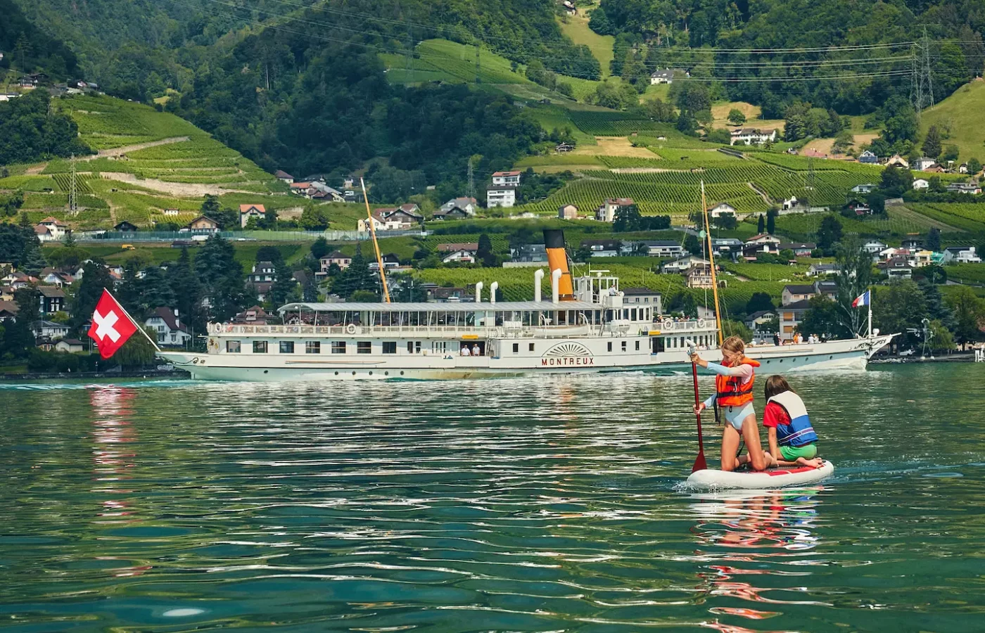 Students on a lake boat excursion during La Garenne summer camp