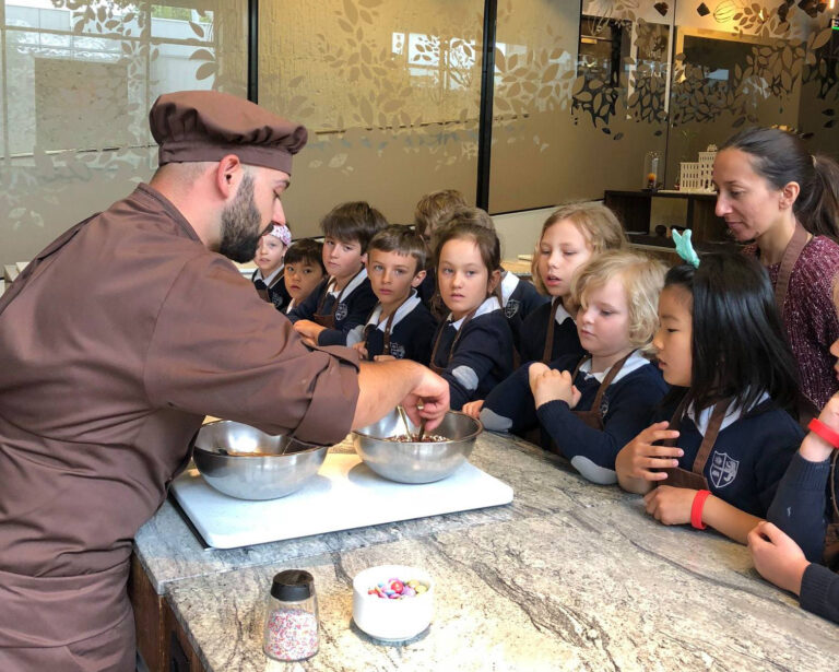 Students visiting chocolate factory during school trip