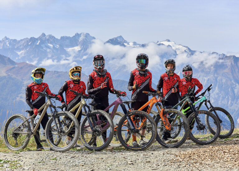 Students mountain biking in the Swiss Alps