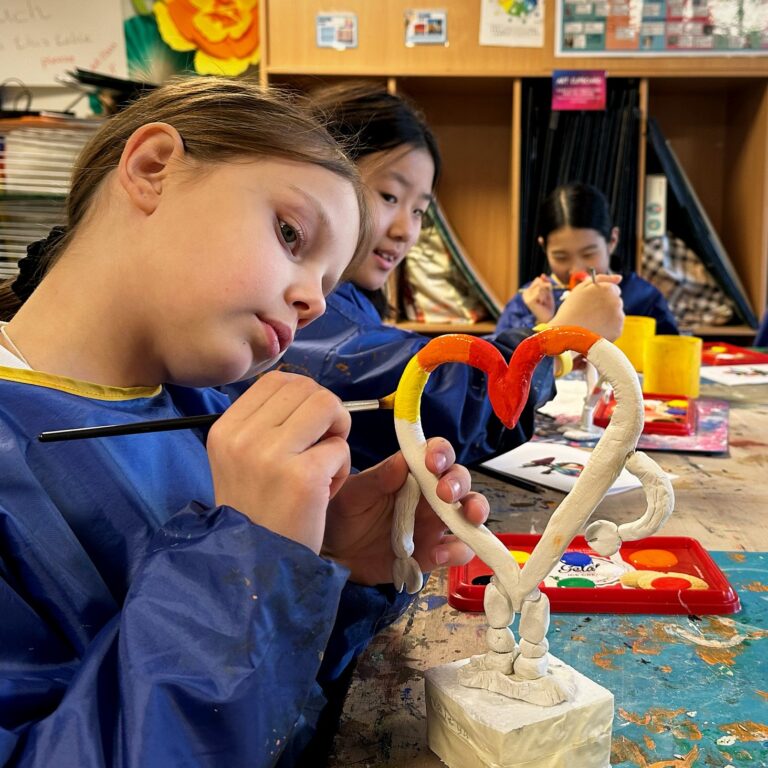 Students taking part in art workshop during summer programme