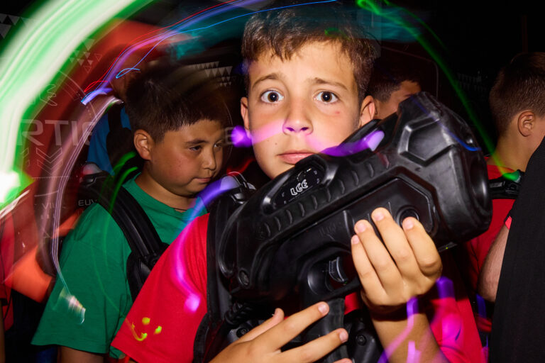 Students playing laser game during summer camp at La Garenne