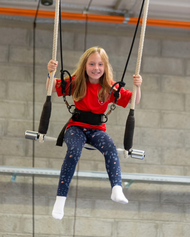 Students participating in circus workshop at summer camp