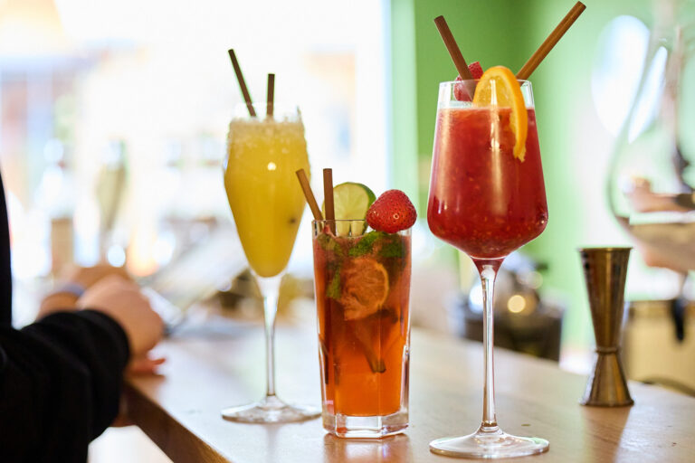 Students making mocktails during summer camp activity