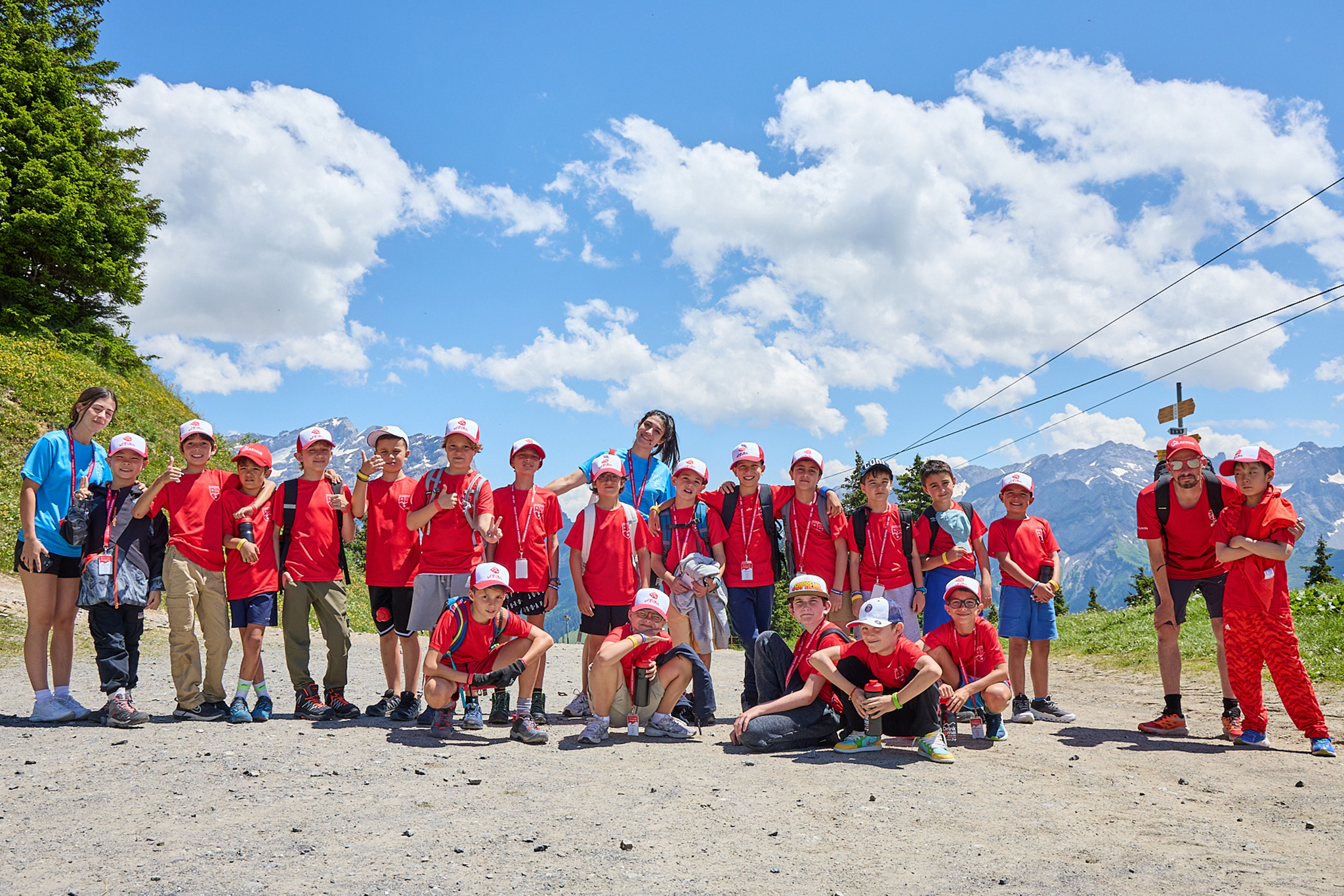 Camp group on an Alpine expedition under a summer sky