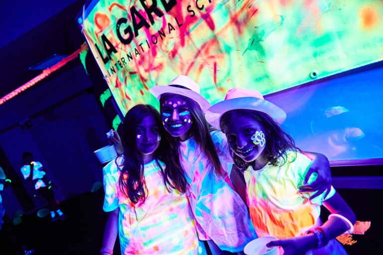 Students at themed fluoro party during summer camp