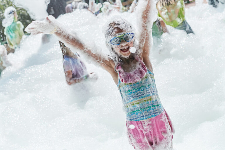 Students enjoying foam party during summer camp