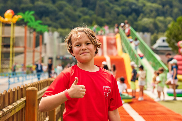Students enjoying fun park activities during summer camp