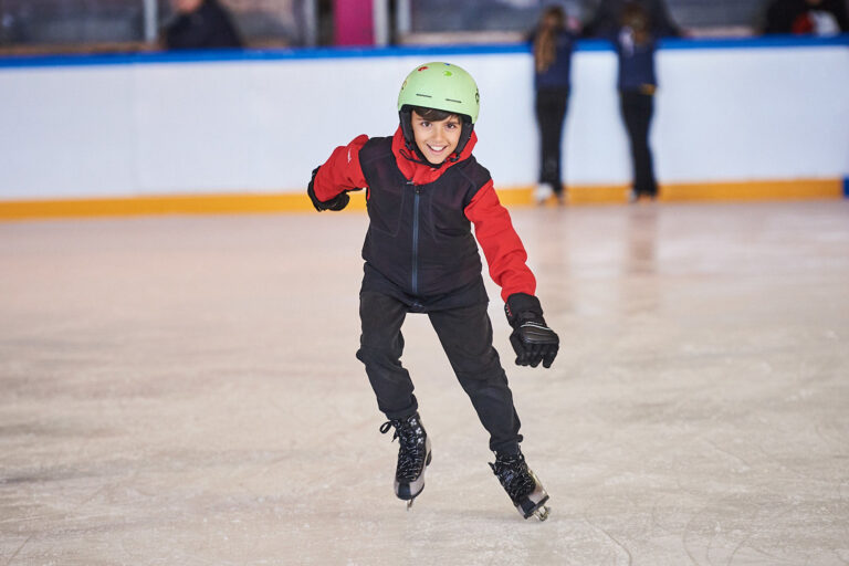 Students ice skating during summer camp