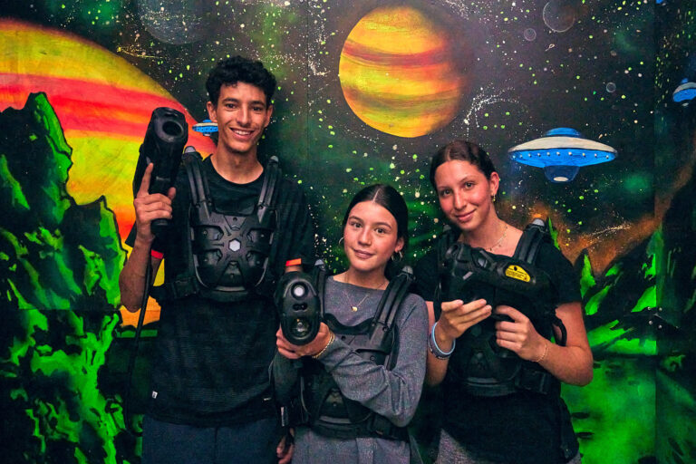 Students taking part in laser game activity at summer camp