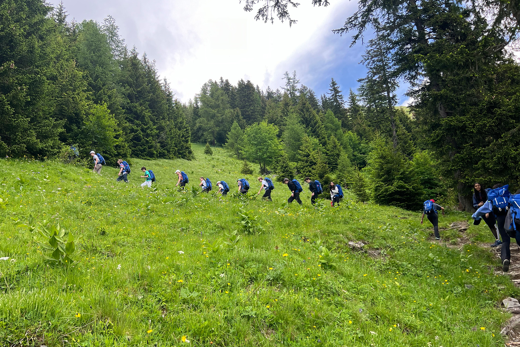 Students exploring mountains during summer camp