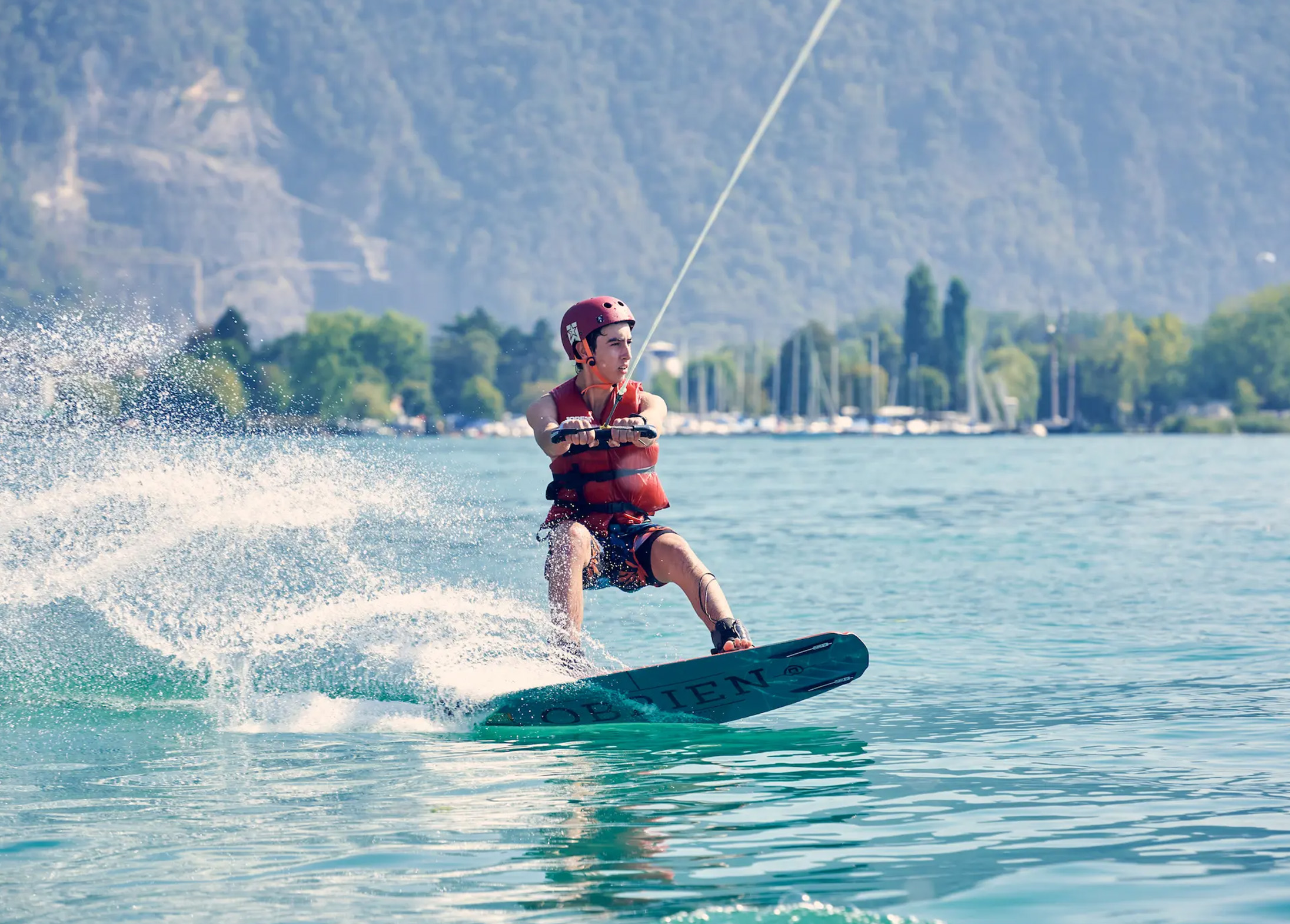A camper wakeboarding on Lake Geneva