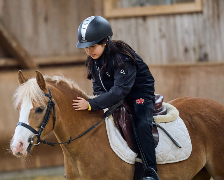 Students horse riding in Switzerland during school programme