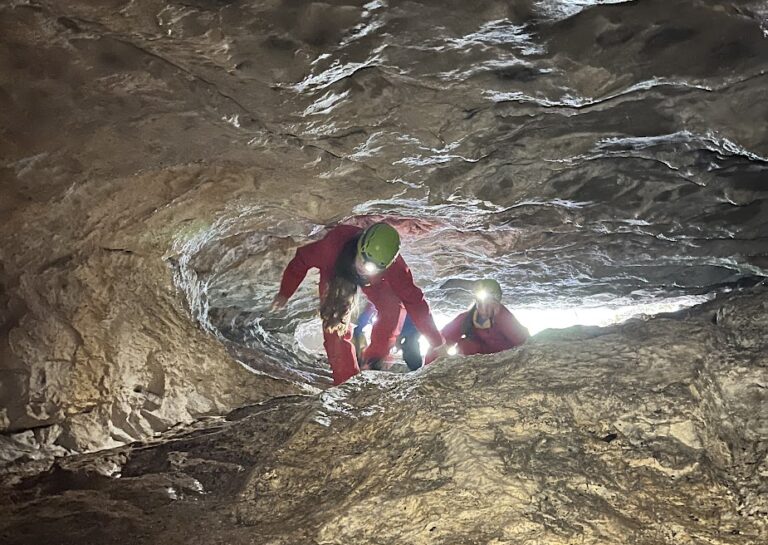 Students caving during outdoor adventure activity