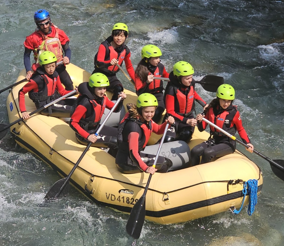 Students rafting during outdoor summer camp activity