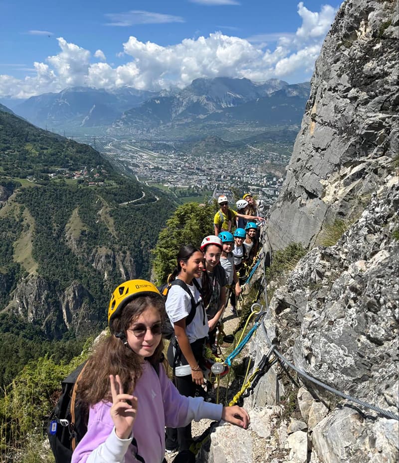 Students rock climbing during outdoor activity