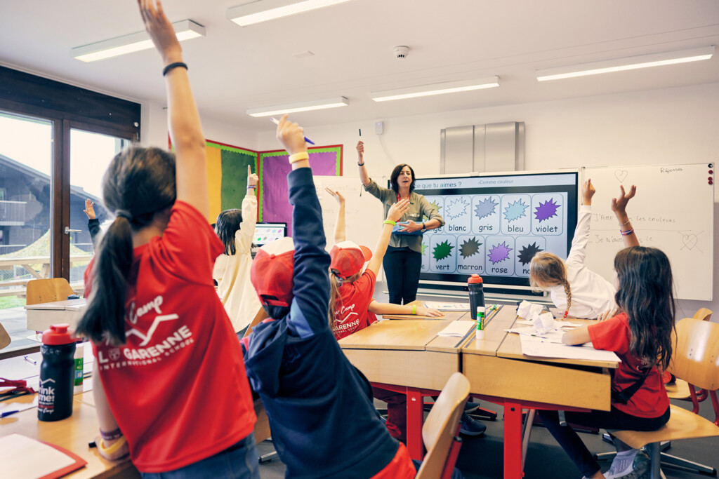 Students learning French in an interactive classroom during the French Language Summer Camp at La Garenne International School in Switzerland.